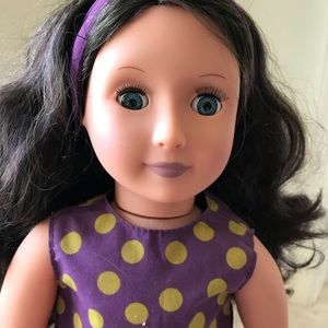 18 inch Our Generation doll with 2 dresses!